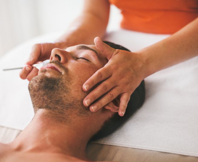 Man getting a face treatment at the health spa at Miami Kimpton Hotel